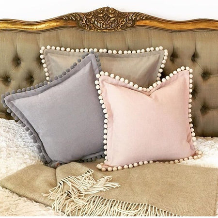 Country style cushions with pompoms